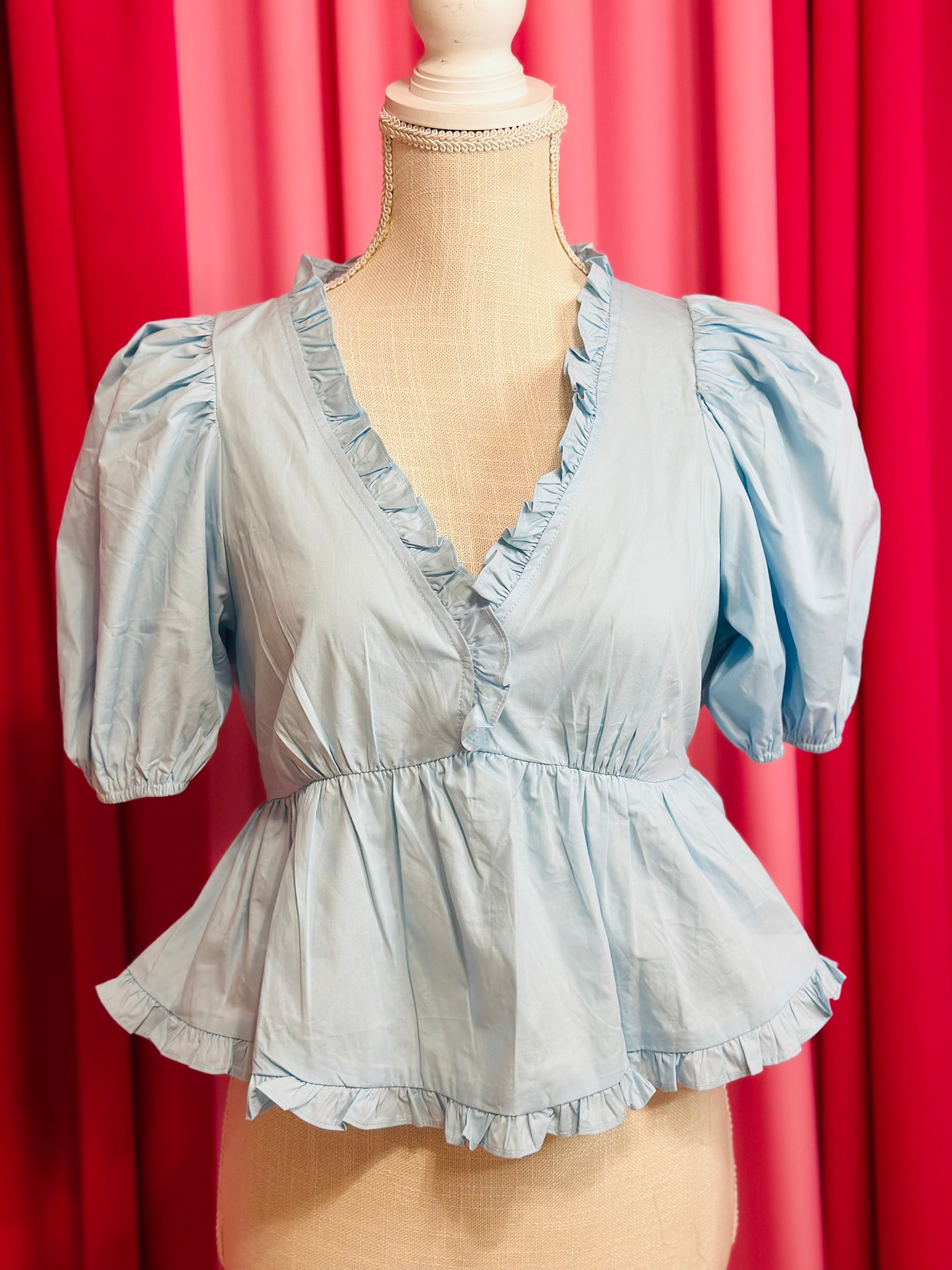 BLUE RUFFLED HEM TOP BY BRITT AND BELLE BOUTIQUE