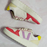 pink, purple, and yellow sneakers
