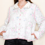 Floral patterned jacket worn by a person on a plain background