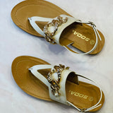 white sandals; gold chain sandals