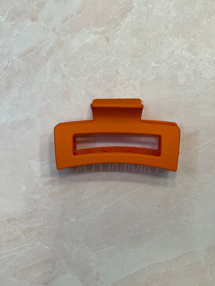 orange hair clip; orange claw clip