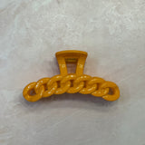 orange hair clip; orange claw clip